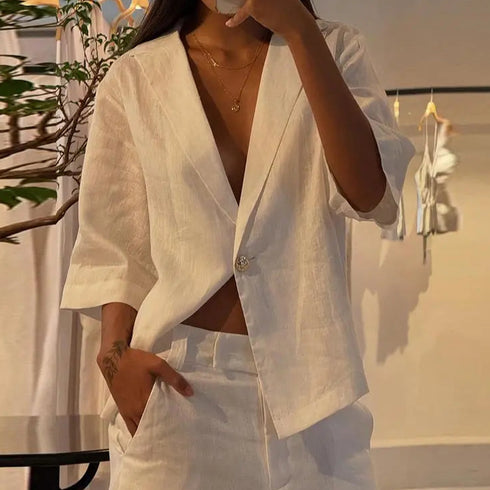 Person wearing a white outfit with a blurred background
